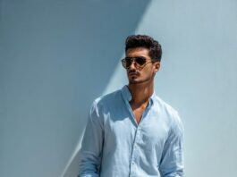 man wearing sky blue shirt with white chinos and brown loafers